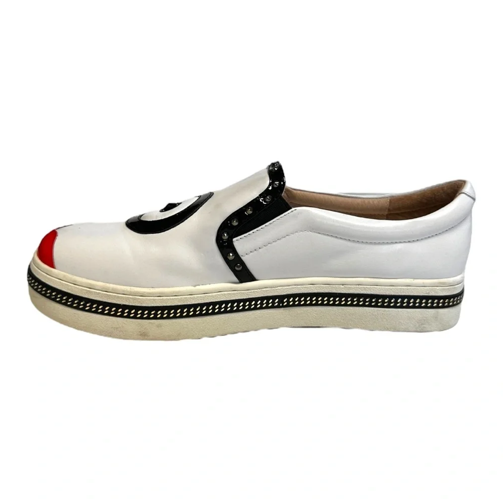 White Leather Slip-On Sneakers with Black Trim and Red Accent